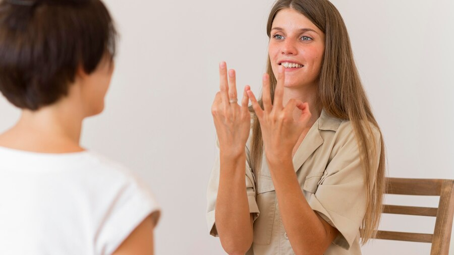 Should I learn sign language from an instructor or take an online course?